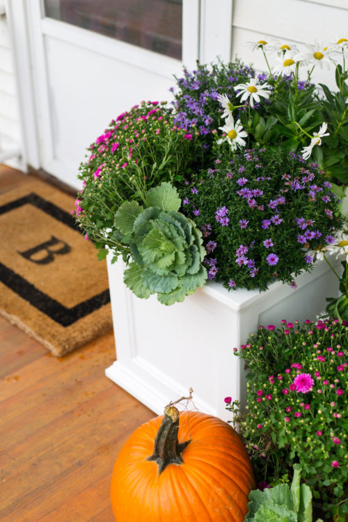 fall planter with monogrammed doormat