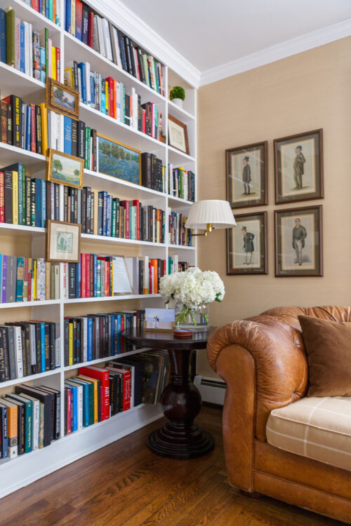 floor to ceiling bookshelves wood pedestal table chesterfield sofa design darling home office