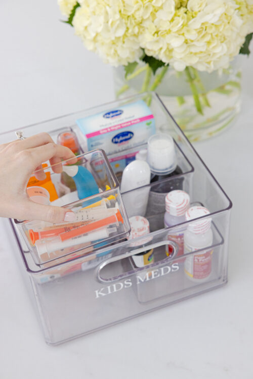 kids' first aid kit bin in pantry