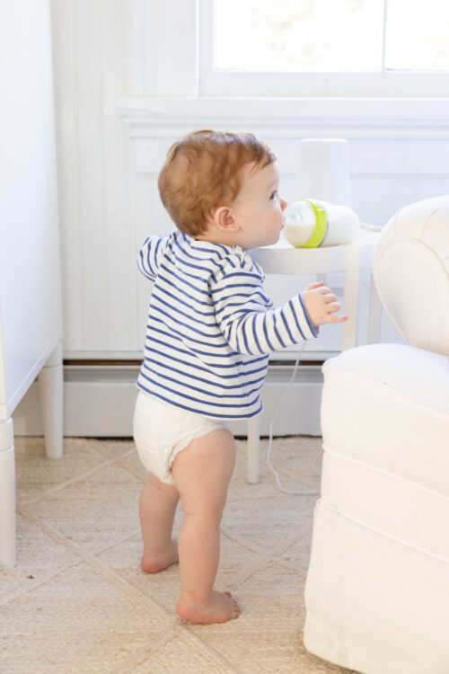 baby drinking from milk bottle