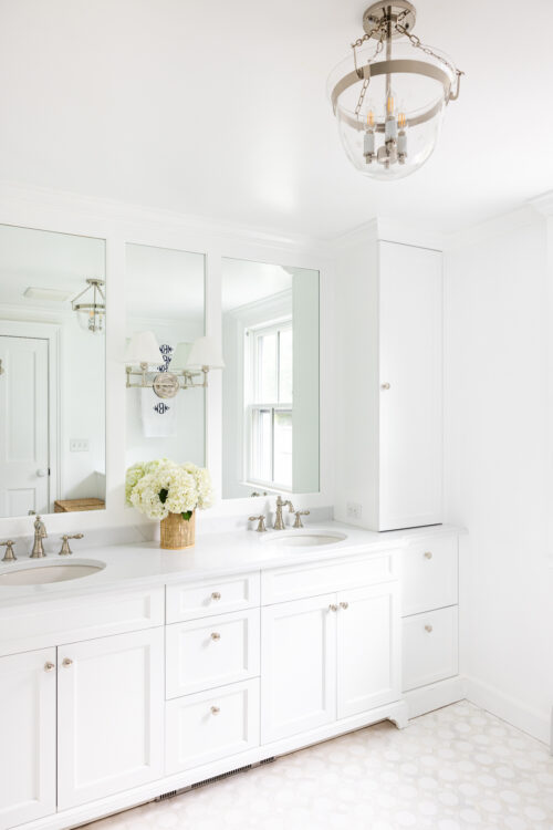 double vanity with storage towers and paneled mirrors